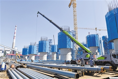 圖為晉北基地同熱三期2×100萬千瓦煤電工程項目建設現場。李冬賓攝